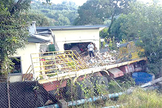 Ranau family cheats death as lorry crashes into house